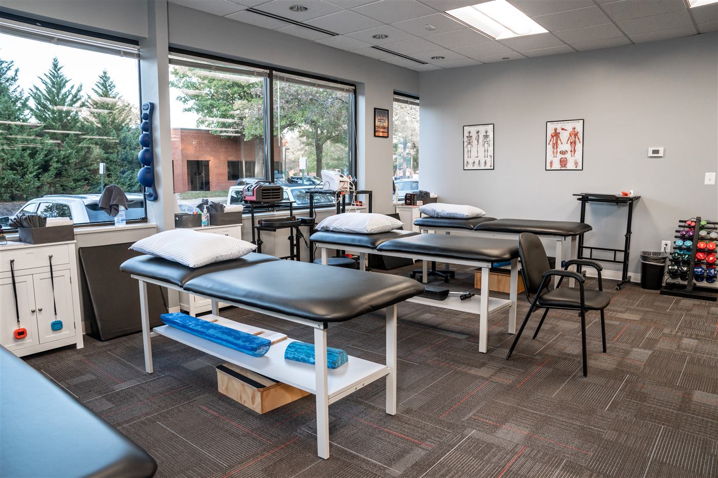 Treatment room with hi-lo therapy tables and natural light